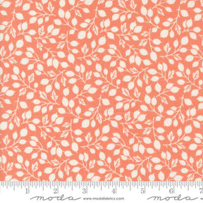 an orange and white fabric with leaves on it