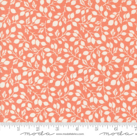 an orange and white fabric with leaves on it
