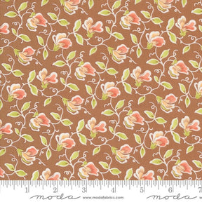 a brown background with pink flowers and green leaves