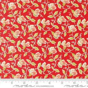 a red background with white flowers and green leaves