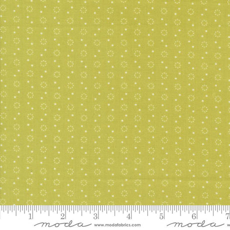 a ruler with a yellow background with white dots