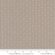 a ruler with a brown background with white dots