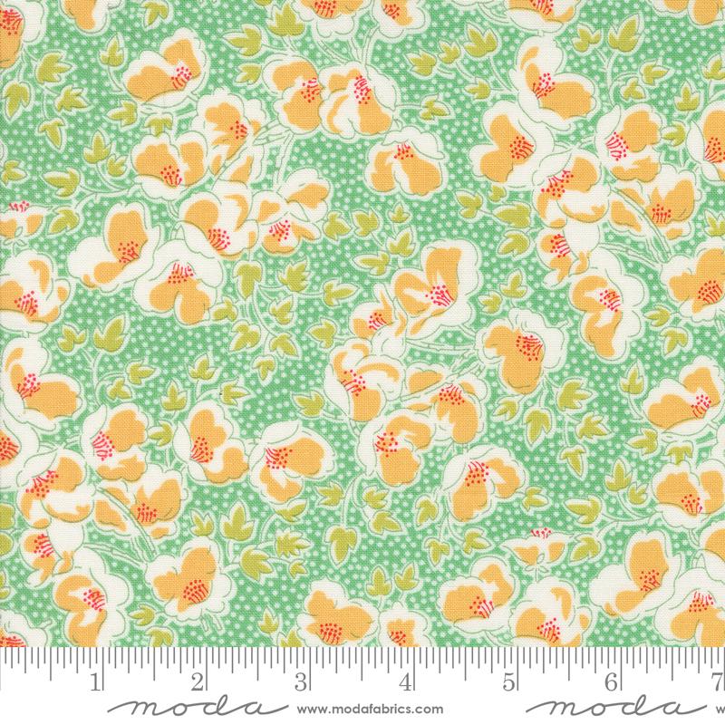 a green and yellow floral print fabric