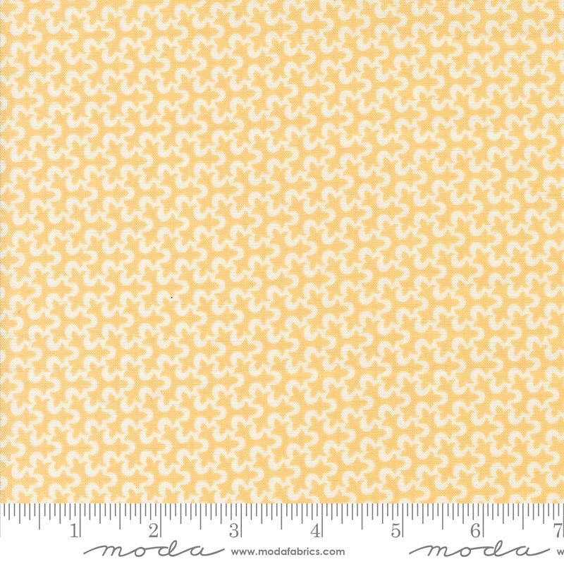 a yellow and white background with a ruler