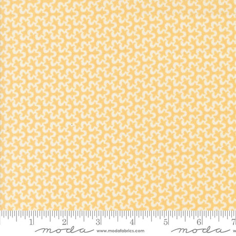a yellow and white background with a ruler