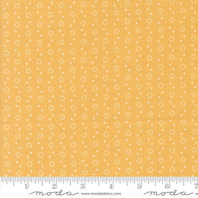 a yellow fabric with white dots on it