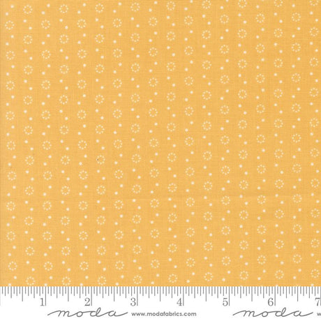 a yellow fabric with white dots on it