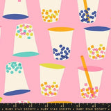 a pink background with cups and a ruler