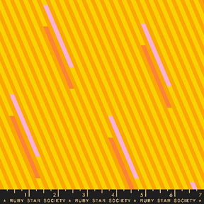 a ruler with a yellow and pink striped background