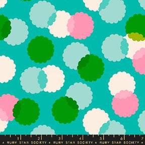 a green and pink cloud pattern on a blue background