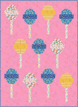 a pink background with a bunch of lollipops on it