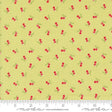a yellow background with red cherries and green leaves