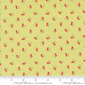a yellow background with red cherries and green leaves