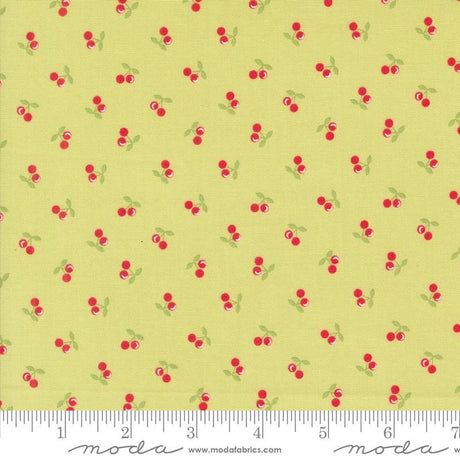a yellow background with red cherries and green leaves