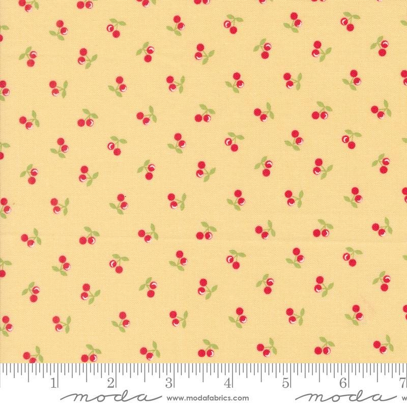 a yellow background with red cherries and green leaves