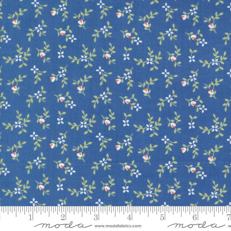 a blue fabric with small flowers on it