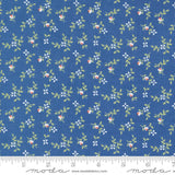 a blue fabric with small flowers on it