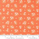 an orange fabric with white flowers on it
