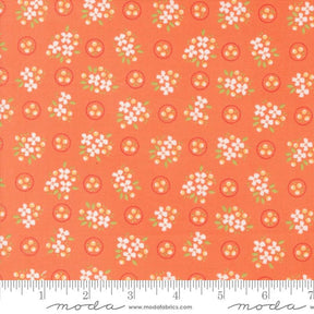 an orange fabric with white flowers on it