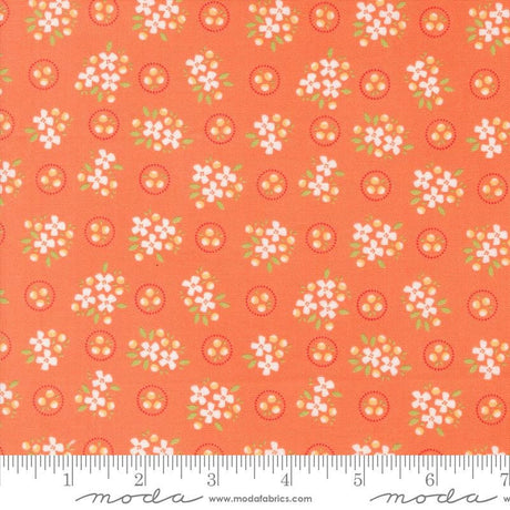 an orange fabric with white flowers on it