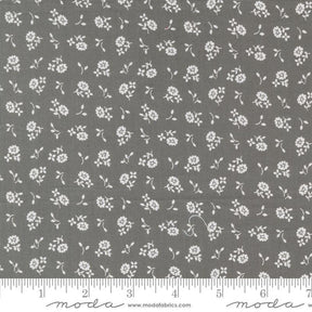a gray fabric with white flowers on it
