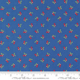 a blue background with red cherries and green leaves