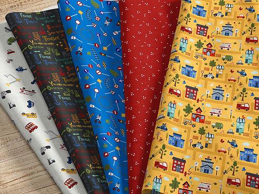 four different types of fabric on a wooden surface