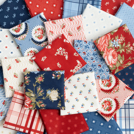 a pile of different colored and patterned fabric