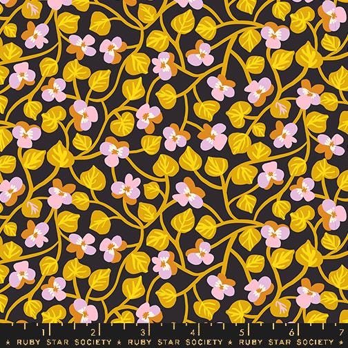 a black background with yellow and pink flowers