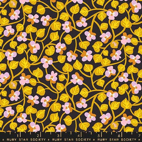 a black background with yellow and pink flowers