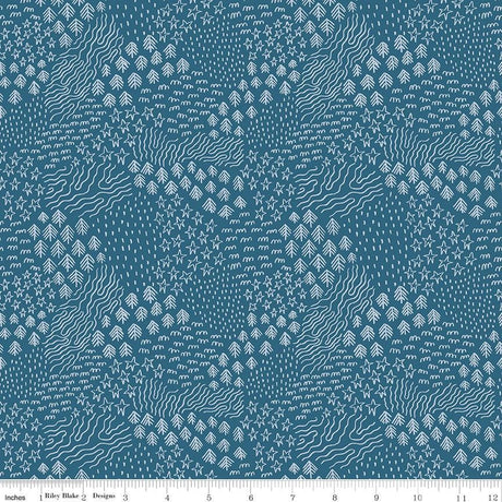 a blue and white pattern with a ruler in front of it