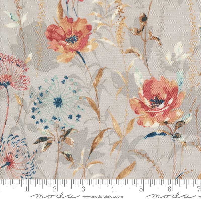 a floral print fabric with a ruler in front of it