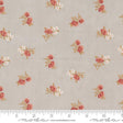 a white and pink flowered fabric with a ruler in front of it