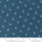 a blue fabric with white flowers on it