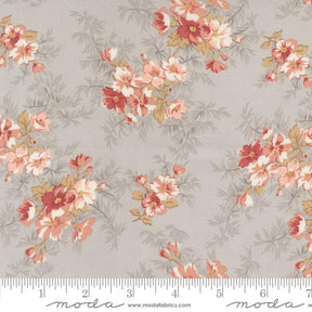 a flowered fabric with pink and yellow flowers on a gray background