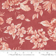 a red flowered fabric with a ruler in front of it