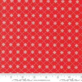 a red fabric with white crosses on it