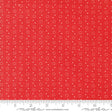 a red fabric with white dots on it