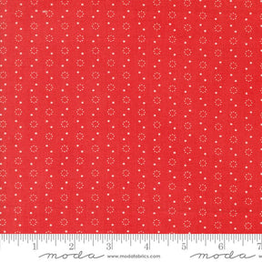 a red fabric with white dots on it