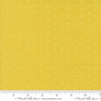 a ruler with a yellow background with white dots