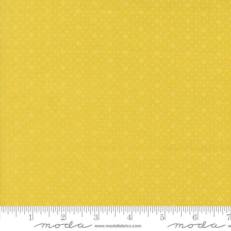 a ruler with a yellow background with white dots
