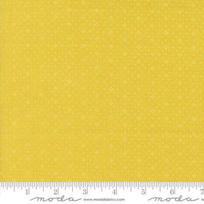a ruler with a yellow background with white dots