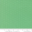 a ruler with a green background with white dots