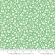 a green and white fabric with leaves on it