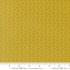 a yellow fabric with white dots on it