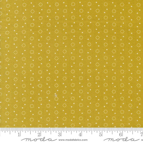 a yellow fabric with white dots on it