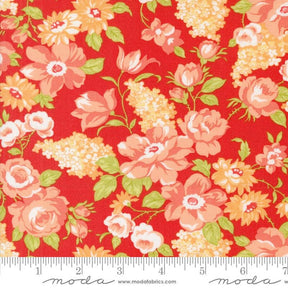 a red flowered fabric with green leaves and flowers on it