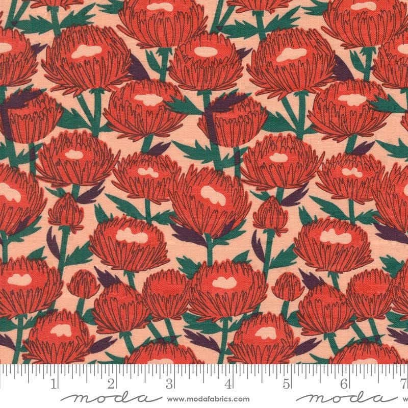 a red flower pattern on a pink background