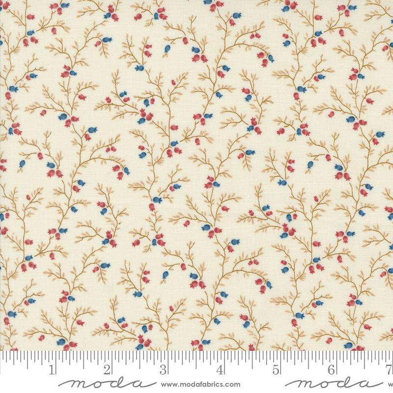 a white fabric with blue and red flowers on it