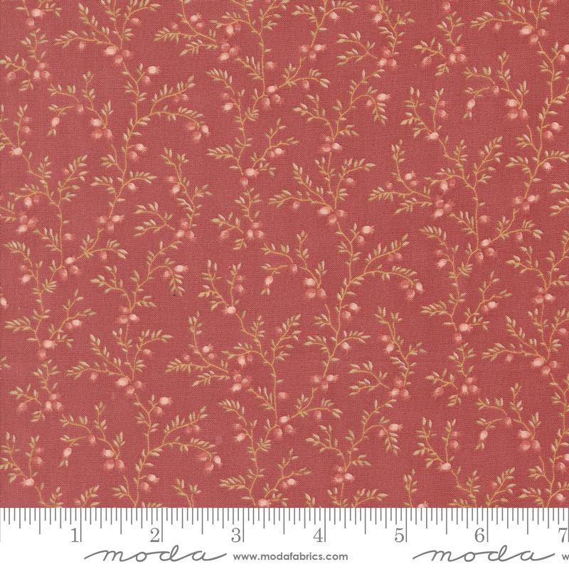 a red fabric with small flowers on it